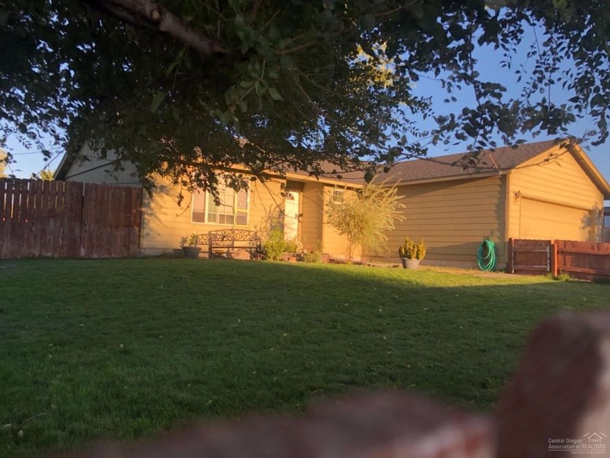 Adorable home on a huge corner lot. Completely fenced and landscaped. Take advantage of the fire pit in the large backyard - perfect for BBQ's. Sellers have converted most of the garage to a large bonus room. They will gladly leave it or return it to original condition. If your are looking for a lovely home in Madras, don't let this one get away!