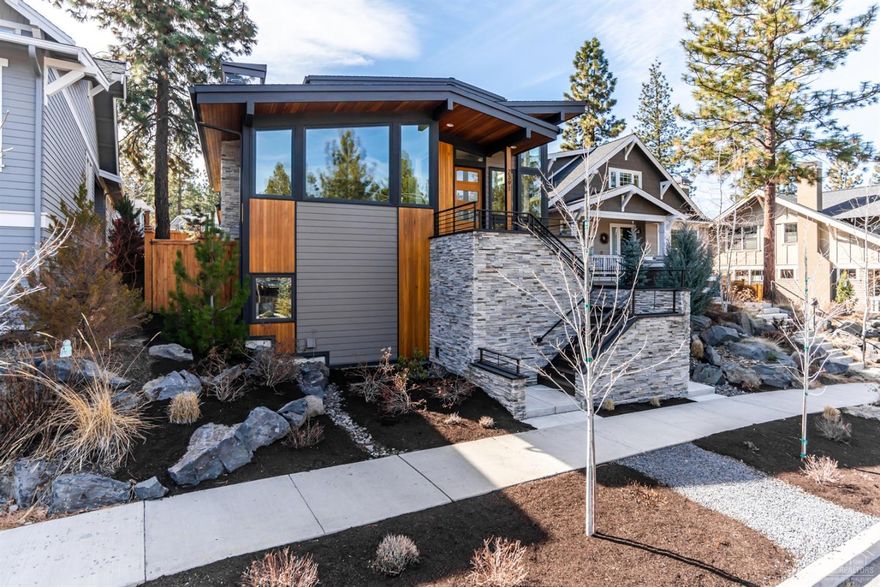 Exceptional quality throughout this Custom Contemporary Stunner. Attention to details shows with top notch Thermador appliances, 4 zone heating/cooling system with WiFi capable thermostats, 50 year roof, Grohe Euro Cosmopolitan fixture, wool carpets, custom window treatments, plank white oak hardwood floors, speakers throughout and so much more. This home feels made for entertaining and family! The master is on the main level and well incorporated with a Spacious Great Room that has views of the treetops. The beautiful open staircase leads to two spacious bedrooms and a shared bathroom. As you move down to the daylight basement you will find the 4th bedroom en-suite with a private entrance, perfect for a live in relative, visiting guest or office. There is also ample storage in the basement. Ideally located in NWX across from Sunset View Park yet walking/biking distance to downtown and all that Bend has to offer. This home won't be on the market long!