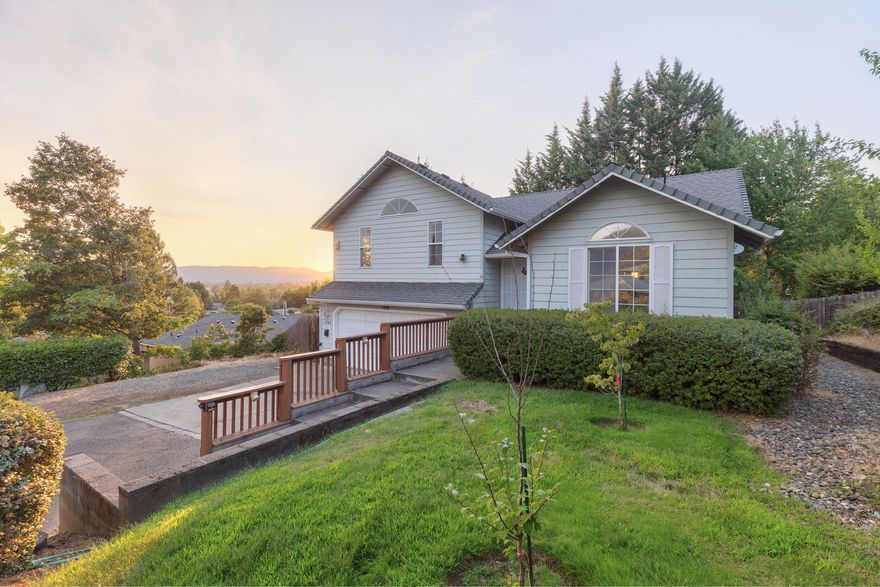 Enjoy mountain and city views from this beautifully maintained home tucked away on a peaceful 0.25-acre lot! Conveniently located near shopping and within the District 7 school boundaries, this 3-bedroom, 2-bath home offers 1,560 sq ft of comfortable living space. The open floor plan features vaulted ceilings, a spacious kitchen with a center island, pantry, and generous amount of cabinet space. A spacious primary suite complete with dual sinks and a walk-in closet. Additional highlights include an indoor laundry room with storage cabinets and shelving. Step outside to a large, fenced backyard and take in the view from the private deck. Set back from the road, this home offers both privacy and tranquility—don't miss this one!