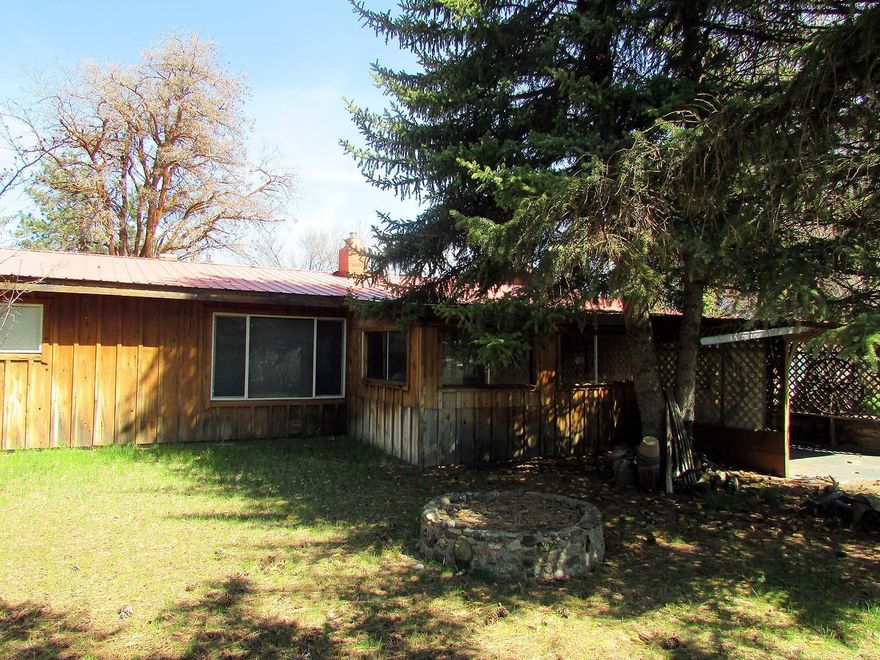 Charming single level, ranch style, 3 bedroom one bath home. This is a rare find, 4.77 acres close to town. Nice clean turn key'' home with cedar siding, large shop, barn and RV parking. Nice covered patio great for entertaining. Numerous, fruit trees, garden areas and other out buildings. What a great place to raise a bunch of critters.