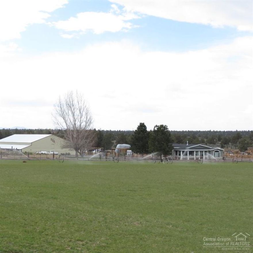 Turn key, farm/ranch/feedlot, plus 10,000SF shop/barn/stalls. 2 beautiful newer manufactured homes. This farm is immaculate with everything needed to handle cattle and farm equipment. Beautiful setting close to fine dining and golf. 15 minute drive to Bend, OR. Possible neighboring pivots and pastures for purchase from adjoining neighbors. Please call for list of all amenities this farm offers.
