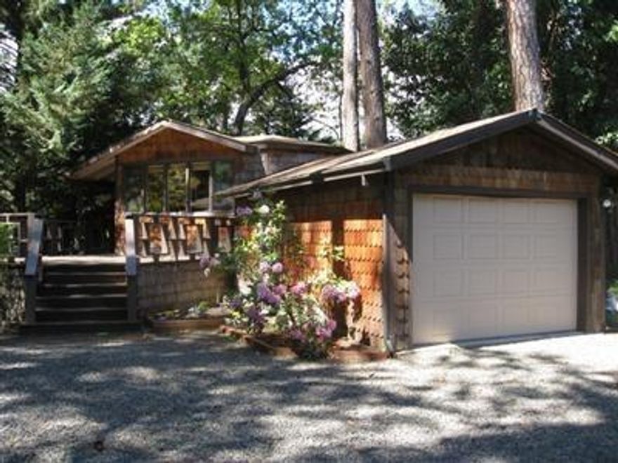 Storybook, park like, riverfront setting! This property has one of the best views along the Upper Rogue. Enjoy sitting on the deck while ducks & geese gather across the river. Tall Ponderosa Pine trees & the river views make this a special place to call home. Featuring an open living room, formal dining room, granite counters in the kitchen, breakfast bar & lots of storage. Office/3rd bedroom w/ extra storage. Large covered front deck along the river and a deck off of the master. Separate hot tub room just off the master bedroom deck. There is an additional building that has enclosed RV parking, a workshop, 2 car garage and 2 story guest quarters with full bathroom. Fenced w/ electronic gate for privacy.