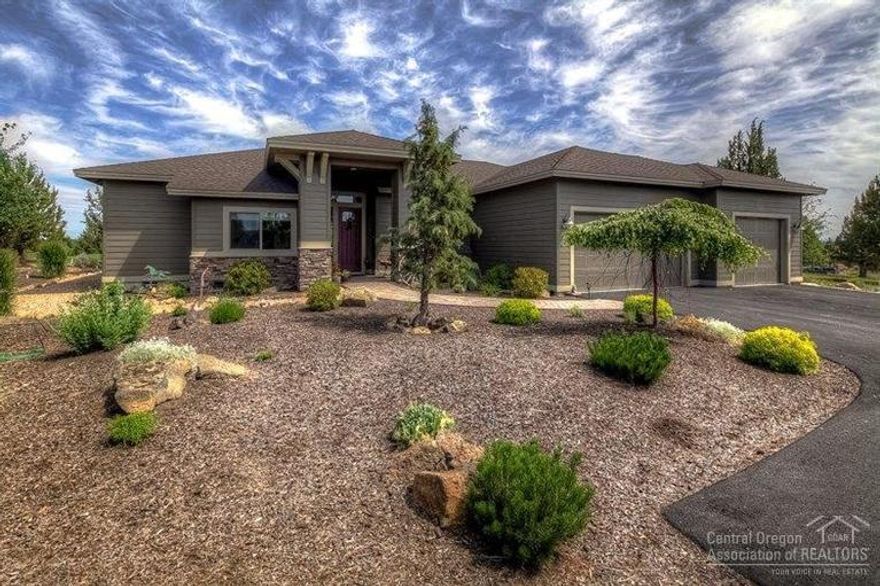 Beautiful one level home overlooking the 6th hole of the Challenger Course & providing easy access in & out of The Ridge. With Mt. Jefferson views & sitting on .52 of an acre, this home is loaded with upgrades including central vac, built in TV cabinet/bookcases, wine cooler & bar sink, tall toilets, extended covered back paver patio, an oversized 36 x 26 three car garage with RV hookup & a perimeter invisible dog fence & dog run. A very warm & welcoming property with extra paved parking areas.