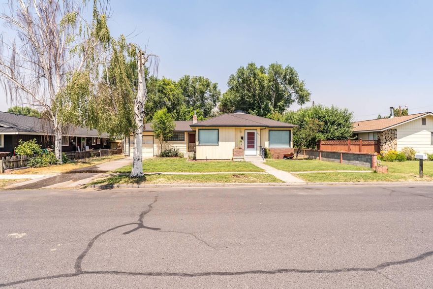 Charming and move-in ready, this adorable ranch-style home offers comfort, updates, and outdoor appeal! Inside, enjoy fresh interior paint, brand-new carpet, and stylish new appliances. The spacious laundry room doubles as a pantry, adding convenience and storage. Outside, the beautifully landscaped yard is fed by an irrigation well—perfect for keeping things green year-round. A large backyard with patio space is ideal for entertaining, and the storage shed keeps things tidy. Additional perks include alley access for extra parking and an attached 1-car garage. Priced to move—don't miss out on this gem!