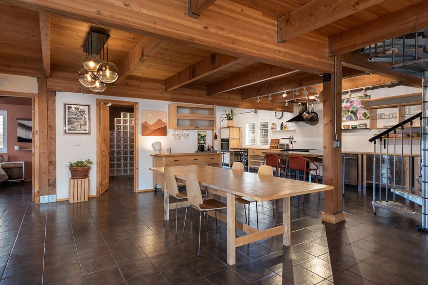 This industrial modern masterpiece is truly one of a kind. This home combines the best of all worlds, with stunning Cascade Mountain views, a contemporary home within a charming barn exterior plus an acre of land adjacent to BLM and 85 acres of community land with a walking trail. Remodeled in 2024 with a new office/bedroom, large walk-in closet in the main floor primary suite, new paint, trim & more, it's just like new. The sleek kitchen features a side-by-side stainless fridge & freezer, Italian oven & French doors opening to the back patio & spacious yard.  A wood burning stove creates a cozy living area with sliding doors leading to the storage shed. The vaulted upper level is also a perfect primary suite option with a full bath with double vanities & walk-in closet. Upstairs is also ideal for an art studio, fitness or addl. work space. Enjoy the pool, tennis & pickleball courts, parks & golf course in Crooked River Ranch. Add a shop or bring your horses!