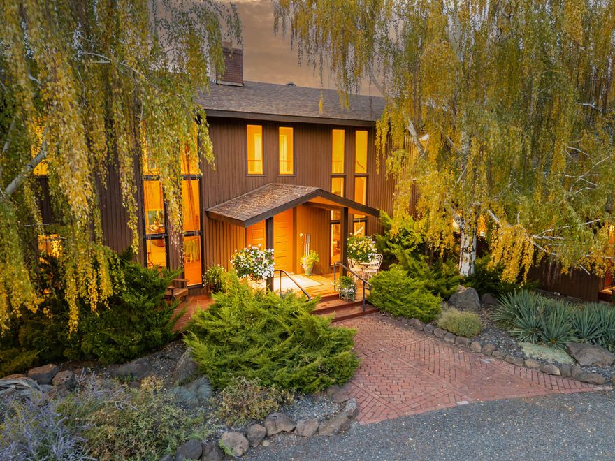 Premier Central Oregon property! On a bluff overlooking the Lone Pine Valley with spectacular Cascade, Smith Rocks & Ochoco Mt. views. Private & peaceful 15.16 acres features a custom 5618 sq.ft. home only 4 miles NE of Redmond. The 4+ bedroom, 6 bath showplace boasts stunning views, his & her walk-in closets and baths, & has multigenerational/mother-in-law capabilities downstairs. Dramatic entry with fountain/planter & a beautiful spiral staircase. Multiple ensuites, library, formal living & dining rooms, family room, parlor & office, plus loads of closet space & storage. Beautifully landscaped grounds with private well, underground sprinklers, mature trees, expansive decks for outdoor entertainment & a huge fenced backyard. Attached, air-conditioned & heated workshop and a 42'x48' drive-through RV/shop with four 14'x14' overhead doors. Abundant wildlife & elegant country living at the end of a private lane & only a few minutes from town. Seller downsizing, many furnishings available