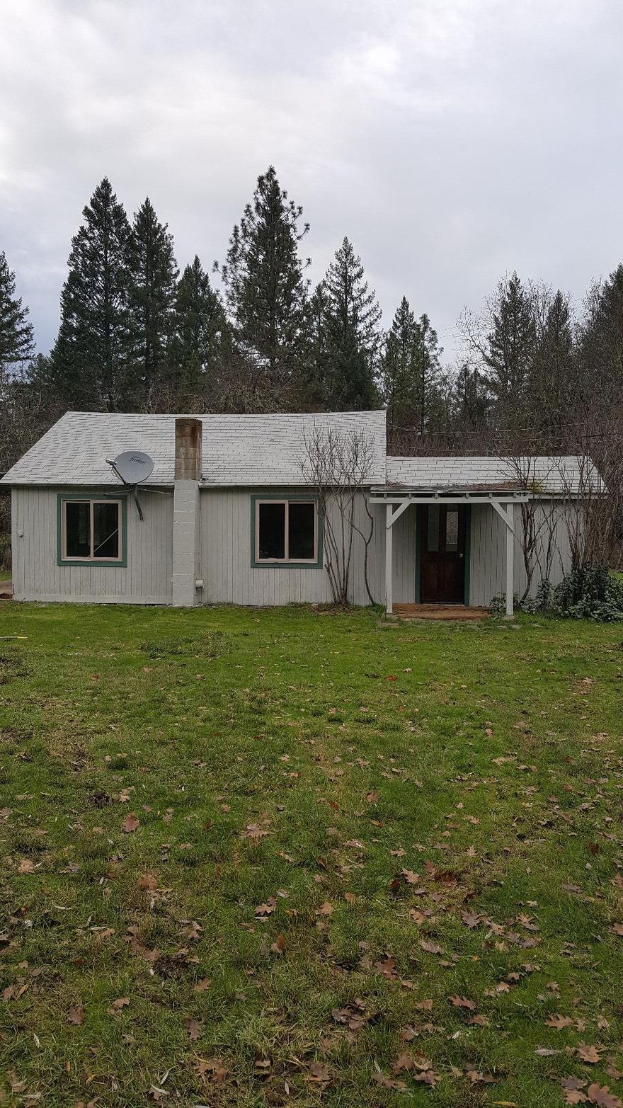 Cozy cottage with a circular driveway is sitting on 2 flat usable acres in the country. This property has a barn, as well as a detached garage/storage building. Fresh paint, carpet and vinyl thru out the home. Enough room for a garden, animals or RV's...This is a nice piece of property! Property sold as is.