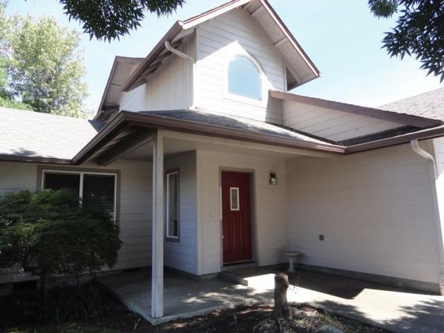 Located in Grants Pass School District 7, walking distance to the river and city parks, this house is a must-see! This home features 3 large bedrooms, 2.5 bathrooms, vaulted ceilings, Large laundry room, a fenced private backyard, and much more. Main floor Master bedroom features a large walk-in closet with built-in shelving,master bathroom suite, and extra storage cupboards in the master bathroom. The laundry room also gives access to a large storage area under the stairs. The backyard has room for a garden and features mature rose bushes and trees. This house also features an in-ground sprinkler/drip system, and has extra space inside the fenced backyard, on both sides of the house. The attached, two car garage is finished and large enough for extra storage as well.