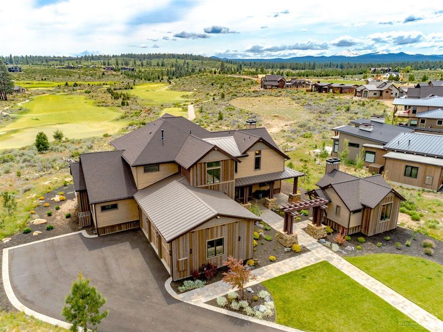 Enjoy modern luxury living at Tartan Druim, a private gated community within Tetherow. Perched on the ridge with incredible views of award winning Tetherow Golf Course and the Cascade Mountains, this exquisite light and bright home boasts luxurious finishes throughout, a beautiful gourmet kitchen with large waterfall island, open dining and living room with a grand modern fireplace, main level master suite with soaking tub, 3 en-suite bedrooms, den/office space, spacious bonus room with expansive deck perfect for entertaining, plumbed for solar, central vacuum, 3-car garage, plus a 431 sq ft casita. High ceilings and expansive windows allow for incredible views from every room! Tartan Druim features private neighborhood access to Phil's Trail and a Central Park of its own complete with bocce courts, playground and outdoor entertaining areas.