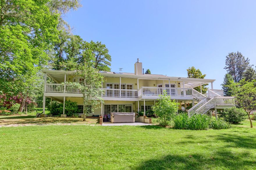 $55,000 PRICE REDUCTION!! Exquisite Rogue River Front property offers access to salmon, steelhead and trout fishing as well as boating, rafting and summer fun from your backyard. Sitting on almost an acre, this gem has more than just breath-taking views from its wrap around porch, it also features 4351 sqft with 2 bedrooms on the main level and 3 more on the lower level plus, 3 full baths. Walk into a spacious open concept with sunken living room with soaring cathedral ceilings, river views and 6 oversized custom skylights showering the area with natural light. Most rooms on main level have french door access to covered wraparound porch and views of river. Large kitchen with SS Frig, island with gas cooktop and walk-in pantry complete this chef style kitchen. Luxury master suite has a romantic feel with vaulted ceiling, french doors, river views, walk-in closet, dual sinks, oversized soaking tub, and a generous shower. Plus a readers dream library with rolling ladder and so much more.