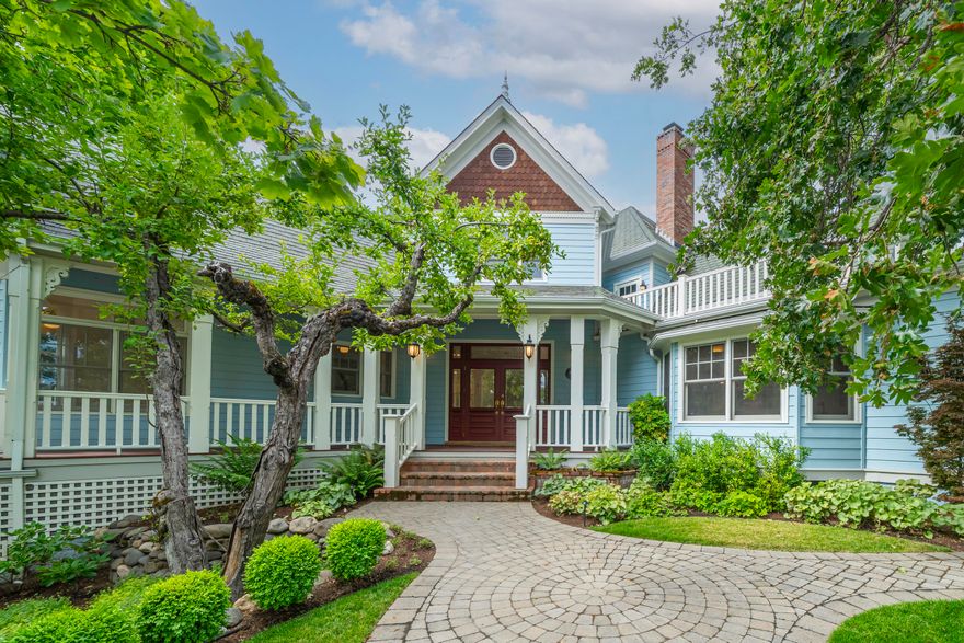 Impeccably remodeled historic home in the desirable Skidmore Academy Historic District - steps from Briscoe Park and four blocks from Ashland's downtown Plaza. Main level with bespoke powder room, expansive gourmet kitchen with new Thermador induction cooktop and ovens, Taj Mahal quartzite counters, gracious formal and informal dining areas, butler's pantry with wet bar, living room, library alcove, two guest bedrooms, renovated guest bathroom, and thoughtfully redesigned pantry laundry room. Upper-level office or potential fourth bedroom with closet; expansive primary with sitting area, skylight, private view balcony, dual walk-in closets, and luxurious full ensuite bath with soaking tub, tiled shower, water closet, and double vanity. Lower-level garage with space for three vehicles, workshop, and utility room. Landscaped grounds with mature trees, ornamental plantings, meandering pathways, patio, and pond with water feature. Inquire for details!