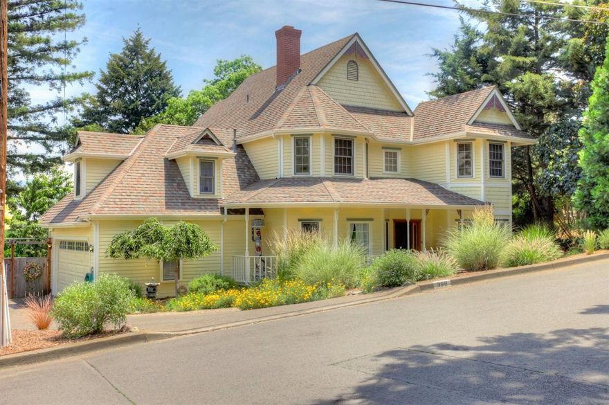 Large beautiful home in the Skidmore Academy Historic District, one of Ashland's most sought after locations! Very close to downtown and everything Ashland has to offer! On the main level there is a beautiful entry with open staircase to the second floor, formal living room with wood burning fireplace, formal dining room (presently being used as a library) sunny kitchen, great room, laundry and powder room. Upstairs there is a large master suite with great views, walk-in closet and bath. There are three additional bedrooms, full baths, and a large partially finished bonus room or space. Large deck, hot tub, and raised organic beds for gardening. The garage is large and finished and there is lots of off street parking.