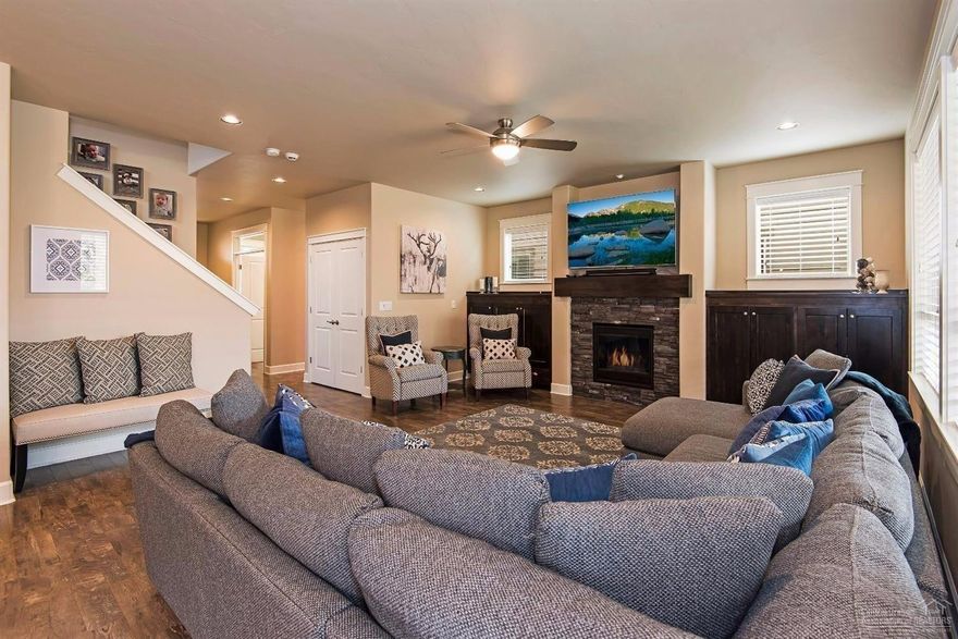 Distinctive 2016 Pahlisch-built home in The Bridges. Exceptional use of space in open 2441 sq. ft. Corbin floorplan teeming with high-end upgrades. 3 beds/ 2.5 baths, plus office with built-ins and massive bonus room. Private, fenced backyard is nicely landscaped with a dog run. Enjoy the covered deck space year-round. Oversized 2-car garage with backyard access. With community amenities including pools, gym, clubhouse and trails this is resort-style living without the resort price. Welcome home!