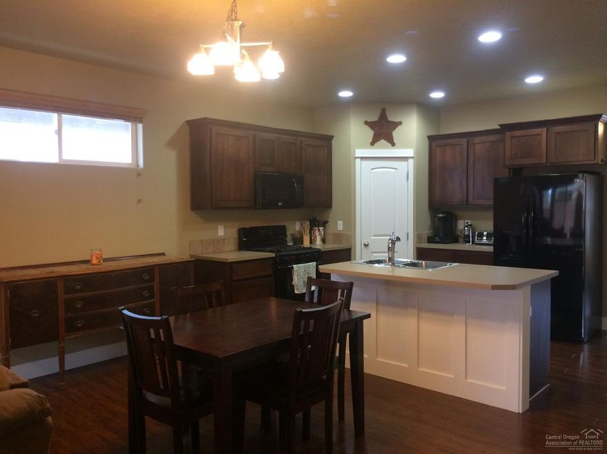 Newer single level open floor plan priced to sell. Good working kitchen with breakfast bar, island and many upgrades. High ceiling with recessed lighting looking out to fenced yard. Extra large master with dual sink, walk in closet and large shower. Energy efficient furnace/AC and Jeldwen windows. Covered porch, oversized garage, close to shopping and medical. No HOAs. Seller ready for quick sale & can move ASAP. Low mainranace yard. Welcome to your new home!