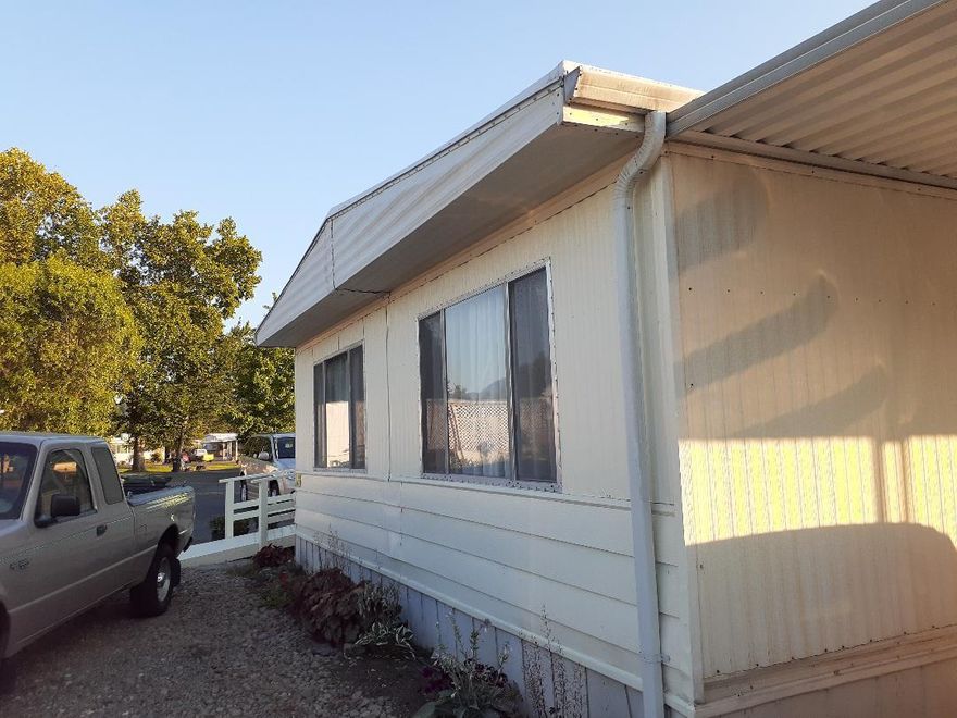 Super clean 1973, 920 sq ft,  2/2 with newer 
heat pump, windows, roof. Has small shop on slab and 2 more sheds, one on slab alongside green garden.  Low Low space rent of approx 340. includes water, sewer, garbage.  Great location to shopping, banks, medical offices and urgent care and hospital.  Private owned senior park off Redwood Ave at 1241 Dowell Rd. #47.