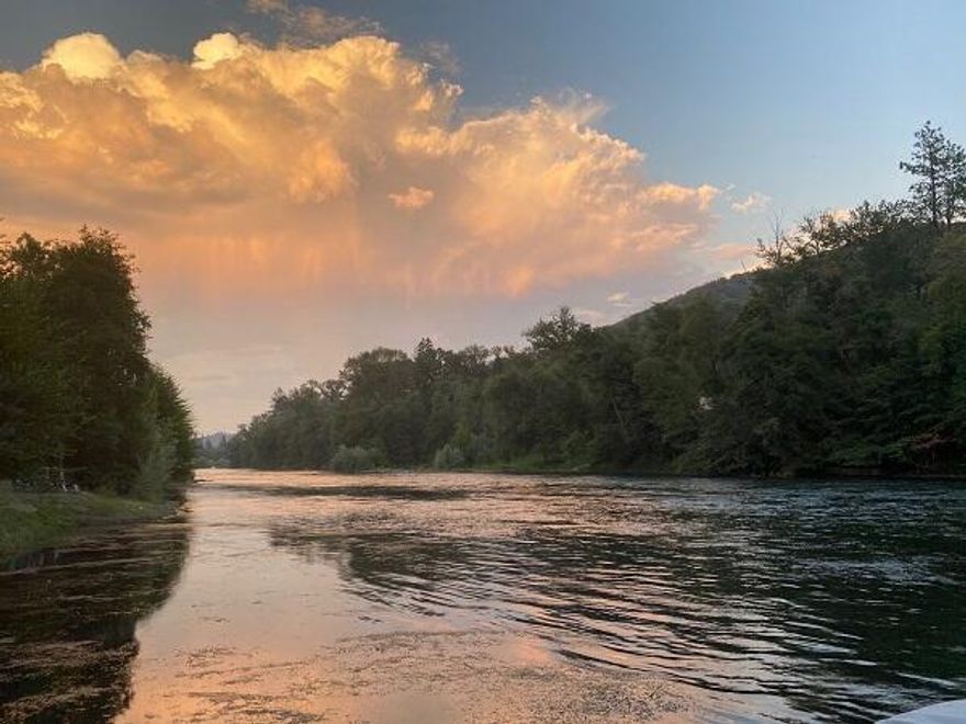 One of the most pristine and private close-in Rogue River parcels left! Level to sloping 2.71 acres with over 132 feet of river frontage situated between two class 4/5 rapids.  Very private! Has well and septic approval per seller, and rough drive cut in from 234.