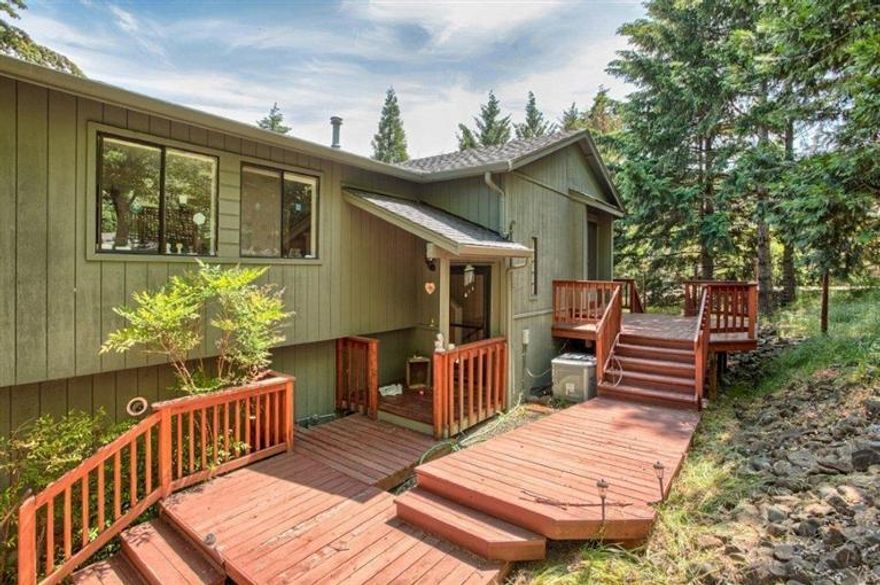 Updated beautiful home with split floor plan and incredible views. Three bedroom three bath with den/office. Home has great light with skylights and multiple sets of french doors. Hardwood floors and tile throughout living areas large living room with family room or formal dining. Bright open kitchen with granite counter tops. Spacious lower level master and additional family room, expansive decks to enjoy the panoramic views. on a .40 acre lot in a park-like setting. Many great features and tank-less gas hot water heater. Home warranty provided by seller.