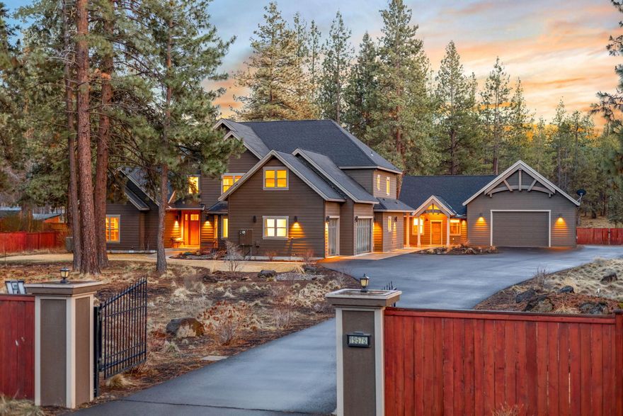 Experience refined living on 2.50 peaceful acres. This estate features a stunning 4,031 sq ft home, a separate 500 sq ft studio complete with a fireplace, kitchenette, bath and laundry which is attached to a climate-controlled 2 bay RV garage/shop with 10' door. 
The welcoming grand foyer invites you in with soaring vaulted ceilings and hardwood floors flow past the formal dining room into the great room, anchored by a dramatic stone fireplace. Light filled floor to ceiling windows frame the pine filled skyline. Eating nook seamlessly connects the beautiful and functional chef's kitchen, ideal for entertaining. Main-level primary suite feels like a sanctuary with a sitting area, spa-inspired bath and enormous closet. Upstairs includes a roomy versatile loft, a bonus room, 2 bedrooms and full bath. The beautifully landscaped, serene grounds feature a 21 ft gazebo with a fire pit. In addition, the property extends way beyond the back fence.