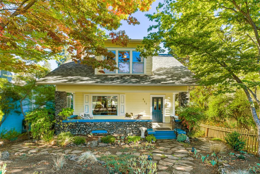 Beautifully preserved and thoroughly upgraded vintage home with guest cottage, centrally located nearby shopping and restaurants. Major systems and efficiency improvements include a 50-year roof, new electrical and plumbing, additional insulation, central heat and air, and exterior siding. Period charm retained by original hardware, leaded glass windows, antique crystal lighting, and romantic archways. Main level features open-concept living and dining, gas fireplace with brick hearth and wood mantle, kitchen with abundant natural light, half-bath, and front porch — an unbeatable spot for Ashland parades! Upper level primary bedroom with walk-in closet, remodeled full bath with custom vanities and large shower, two additional bedrooms. Massive 832 SqFt lower level storage/workshop space with interior and exterior access. Private back deck, sauna, patio, mature trees and landscaping. Detached guest cottage with full bath. Three parking spots with paved alley access. Inquire for details!