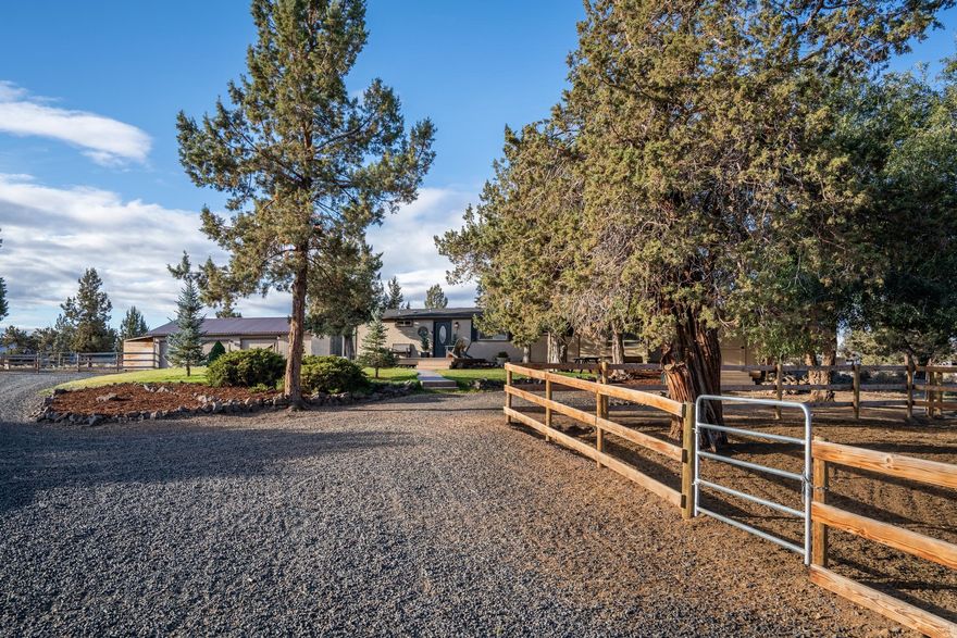 Mini Farm Horse Property on 2.36 acres in SW Redmond. Nicely updated Manufactured home has 3 bedrooms, 2 baths with great room style floor plan. Home's interior features are warm and inviting with tile kitchen countertops, new stainless appliances and new heat pump, easy care tile flooring . Addition Built in 2015 offers 490 additional s.f. of living space for a total of 1,704 square feet perfect for growing families. Detached 2 car garage has new garage door, workshop area and finished office. Outside is landscaped with nice sized front decking, wood fenced paddocks/pens and shelter, fenced private backyard, new storage shed, and chicken coop w/large run. Great rural location just outside the Redmond city limits and minutes from Ridgeview High School. Short drive into Bend. Round your horses up and bring'em on over. This property might just be perfect for you and your family.