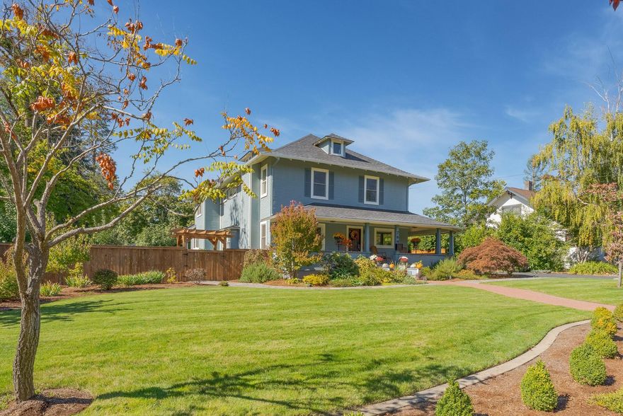 Traditional Beauty! Totally renovated, 4175 sq ft, & meticulously cared for inside & out. Set back, past a beautiful lawn that welcomes you to the lg front covered porch.  Specialized decorative tile entry, wood floors & cherry wainscotting welcome you to a time gone by.  Beautiful wood stairway to the 2nd story & wood framed vinyl windows thru-out for energy efficiency.  Formal living rm, oversized formal dining rm & a kitchen to match ANY kitchen in the valley! Lg eating island, tons of storage, walk-in pantry, Blue Star 8 burner gas stove, quartzite counters, wine fridge & dishwasher.  Light & bright w/rear covered porch for eating/entertaining & overlooks a small pond, gardens w/fruit trees, greenhouse & small shed.  Gas fireplace in living rm.  All bdms are upstairs (total 4 bdm, 3+ ba)  & the baths have been updated w/tile work, glass & new amenities. Basement for more storage or....? Gated, private yard, + office/media rm space over the lg attached garage & rm for RVs.