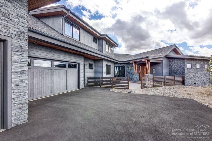 Amazing Contemporary Home, Private Setting on 1.07 Acres, Incredible Mountain Views, Spacious Outdoor Living Area with Outdoor Fire Table and Premium Saline Hot Tub, Open Layout, Hardwood Floors, Gourmet Kitchen and Pantry, Two Masters on Main, Earth Advantage Platinum Designation, Top of the Line Sierra Pacific Windows, High Efficiency LED Lighting, Instant Hot Water Recirculating System and Solar Shades. Fully Furnished and Turn Key Ready! This Home is a Must See!