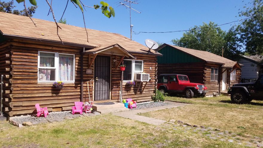 Investor's special- Two (2 BR/ 1 BA) detached homes on one property in a great downtown location, directly across from the elementary school in Eagle Point. Property is backed by Little Butte Creek and each home has a fenced backyard overlooking the creek.  Many updates were done including sewer & electrical. Both homes have log siding but are stick-built. Good Tenants in place that would prefer to stay.