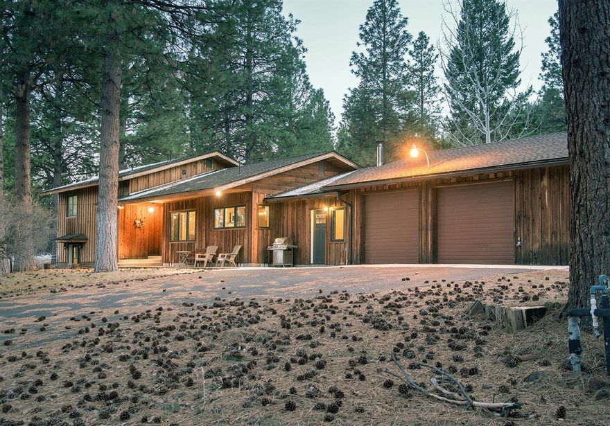 This stunning home has been fully remodeled and is like new! Located in Whispering Pines, this multi-level home features custom cherry cabinets throughout, an open kitchen with custom Corian counters, a double pantry and wooded views of the property from the window. The living room has large picture windows to take advantage of the peaceful pines with a new woodstove and beautiful custom woodwork. All bathrooms have been remodeled with custom tile work, cherry cabinets and tasteful fixtures. The oversized garage has plenty of shop space, and outside the property features a year-round pond, pastures and a horse barn. Set back from the road, this home offers peace and solitude in an area of natural beauty.