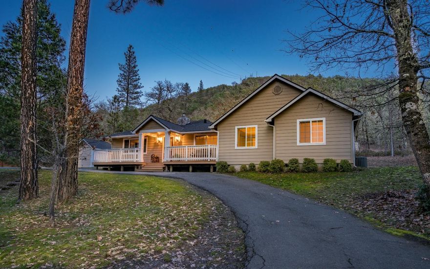 This 2.75 acre property boasts a tastefully updated 2,622 SqFt home. The setting is peaceful & provides a sense of privacy, all while being less than 5 minutes from conveniences & Interstate-5. Featuring an open floor plan with 2 living spaces, a beautiful island kitchen, dining room, 3 bedrooms, 2 bonus rooms, 3 full bathrooms & a laundry room. As you enter the living room, you are greeted by high ceilings with wood beams & a stone fireplace. The large island kitchen is a chef's delight with ample storage, breakfast bar that is open to the dining area & family room & a stainless appliance package including a propane range/oven, & 2nd wall oven with built in microwave. The master suite features 2 closets, access to a 2nd large concrete patio & beautiful bath. Outside you will find a lawn area with kids playground & well maintained grounds with rolling topography & a mix of trees. There is a detached garage & ample parking including RV. Additionally, there is a pad cut for a shop.