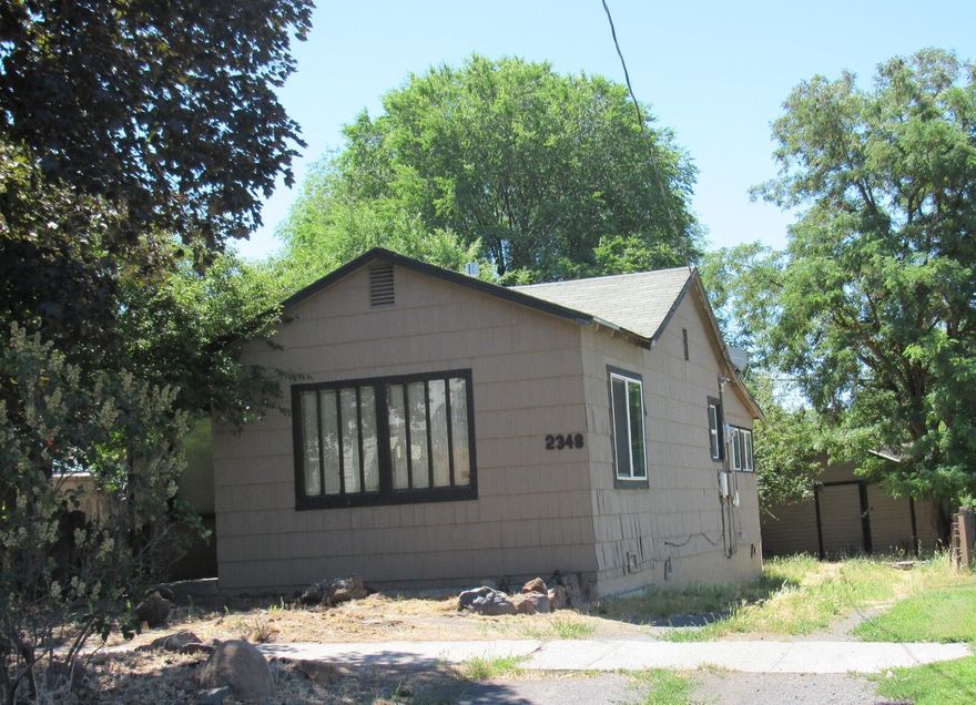 This 2 bedroom 1 bath home has just had the interior painted and new floor coverings are getting installed.  Detached garage and it also has a shed.
