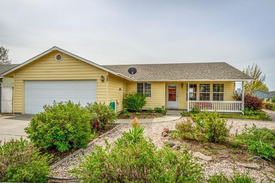 This single level cheerful, light and bright home on a large corner lot in this tidy neighborhood is just minutes from downtown Prineville. Features include a covered front porch, mature landscaping and storage shed in the backyard. It provides a great opportunity for a first time homebuyer, an investor or a downsizing homeowner. The vaulted ceiling in the great room creates a light, open and inviting space. Laminate floors in the great room, oak cabinets in the kitchen and new kitchen countertops, range oven/range, refrigerator and cadet heaters make this turn key and ready to move in.