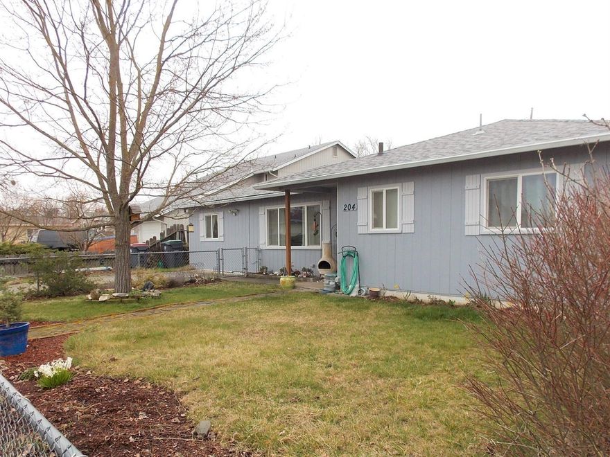 Very nicely updated home in quiet neighborhood. The property has endless possibilities as a starter home or as an investment opportunity. This is a 'Move in Ready' home and has newer hot water heater, Vinyl Windows, siding and ext. paint, HVAC, laminated floors and carpeting. Kitchen boasts clean white cabinets, refrigerator, D.W., and range incl. in sale. Plus large laundry room/panty or storage area. Light and bright living room is connected, through beautiful French doors to Family room or den. Nice large updated full bathroom with wainscoting, 3 bedrooms, den and dining area w/sliding glass doors out to covered patio make this 1342 Sq. Ft. home a real charmer. 2 sheds for storage and separate area in yard for gardening. Plenty of room for outdoor living in the large fenced backyard and alley access. This property has tons of potential and City of Medford says an Additional Dwelling Unit could be built on the lot. All this and a home warranty too!