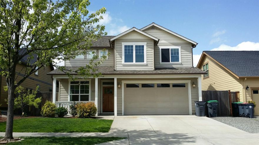 Desirable SW Medford location close to South Medford High! This beautiful, 1793 sq ft two-story home has 4 bedrooms and 2.5 bathrooms w/ 9 & 20 foot ceilings, site finished hardwood oak floors, gas fireplace, molding and base molding throughout, and upgraded light fixtures. The kitchen features slab granite countertops, gas stove, built-in microwave, & dining area. The home includes a separate heating & cooling system for each floor, upstairs laundry with washer & dryer, tinted clerestory windows in entry/livingroom, centralized computer wiring, and a craftsman style solid wood entry door. The lush back yard includes a large covered back porch patio, lawn, garden bed with berries with fully automated irrigation system. Just 2 blocks from South Medford High School and in the Griffin Creek Elementary boundary.