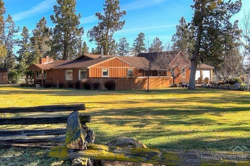 Very Close to riding trails on 9.38 acres, home is filled with charm and updates. Property and house capture mountain views of the Three Sisters. Home has vaulted and beamed ceilings in living areas, barn wood and knotty cedar accents throughout. Sky lights and large picture windows allow natural light. Old World Barn with shop area, 63' X 120' arena, 12' x 33' dog run. Mature landscaping, many trees, Rock gardens, lovely decks including a privacy deck off master with a spa. Sisters School District.