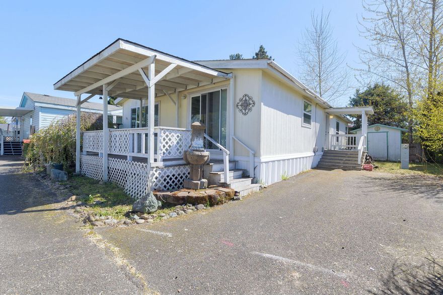 This unit features an open floor plan with vaulted ceilings and plenty of windows to provide natural lighting.  The home has a large living and dining area with sliders to a covered front Trex deck.  The master suite is large, with walk-in closet, spacious bathroom complete with soaking tub, separate shower, double vanity,  and handy  linen closet.    Additional bedrooms are good-sized.  The roomy kitchen includes a separate pantry and all appliances.  There is storage everywhere including in the mudroom/laundry.  The unit is located in the 55+ Redwood Acres Park which has easy access to shopping, medical and city services.   Space rent is $475 per month & includes water, sewer & trash.   Buyers must contact park manager to apply for space.