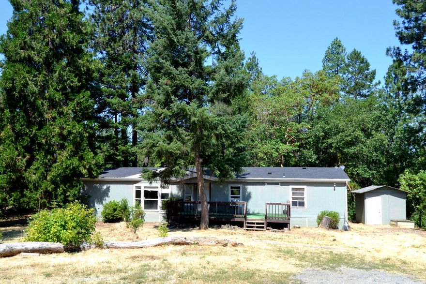 Opportunity knocks! You don't see all of this for this price any more. 5 acres and a large double wide manufactured home for a very low price.  Sure it needs some work. The bones are good.  Has a good well. In.a desirable location with lots or privacy and a beautiful setting and all for a low price.  Lots of room to build equity.