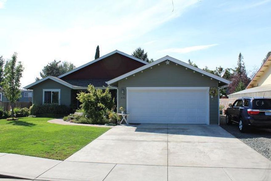 This home was built in 2012 by Cliff Woodruff. It makes the best use of the 1346 square feet. Vaulted ceilings in the living area make this home feel very spacious. This Home offers a split bedroom floor plan. There is a nice patio off the living area overlooking the beautiful back yard. If you have been contemplating building, you are aware of the small lot sizes. . This home is situated on .21 acres. Well established landscaping welcomes you. There are covered patio's in the front and back yard. RV parking is also available. Current owner can park his log truck on the side and still have ample parking for other vehicles. There is an attached, finished, two car garage. Drop down ladder in the garage access additional storage space. This home is conveniently located in the NE part of Grants Pass.