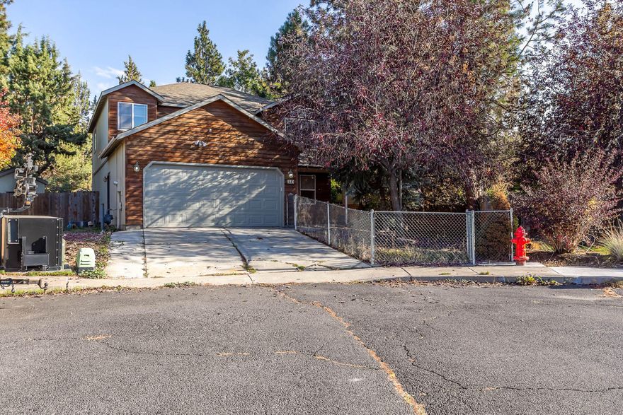 Welcome home! This charming home sits in the heart of SE Bend, surrounded by parks and backing to the popular Larkspur Trail. High ceilings, a generous kitchen with gas range and 2 pantries, a cozy gas fireplace, spacious primary suite, and all new flooring, interior paint and bathrooms. The kitchen, living, formal dining area, half bath and utility room round out the lower level, with 4 bedrooms, including the primary en suite and a full guest bath located upstairs. The yard is fully fenced, offering a covered back deck, large shed, raised garden beds and access from the back yard right onto the trail - the graveled parking alongside the driveway is a great spot for an RV/trailer. Whether continuing to rent or moving in, this is the perfect base to fully enjoy the Central Oregon lifestyle.