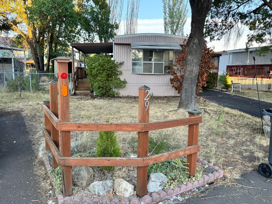 MOVE-IN READY & NICELY UPDATED! This newly remodeled single wide mobile home features fresh interior paint, new flooring throughout, and updated countertops. Located in a well-maintained park with a monthly space rent of $850, this home offers convenience and comfort just minutes from town. A perfect place to settle in and call home! Owner is a licensed Realtor and the listing agent.