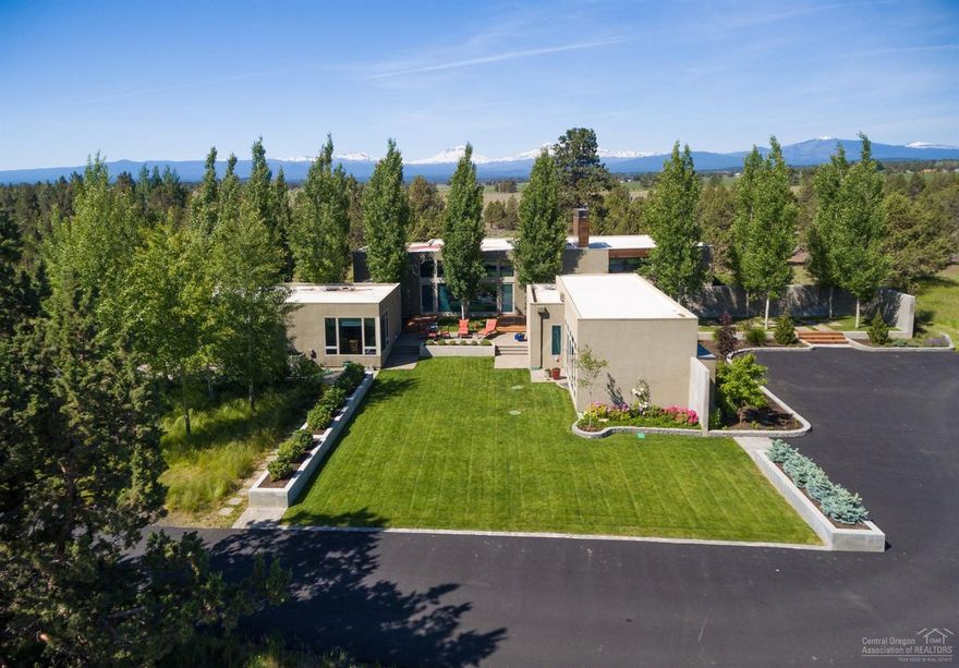 Simply spectacular 40 acre horse property near Sisters, Oregon. One-level main house designed by Robert Thompson w/ massive windows framing majestic Cascade Mountain views & pristine views of the natural high desert landscape, sold furnished. Equine facilities include a 4 stall barn w/tack room, horse run-in shelters, hay barn, exterior riding arena, pens & grazing paddocks. A studio/shop building & an additional storage building round out the amenities. Gated & fully fenced. It just doesn't get any better!