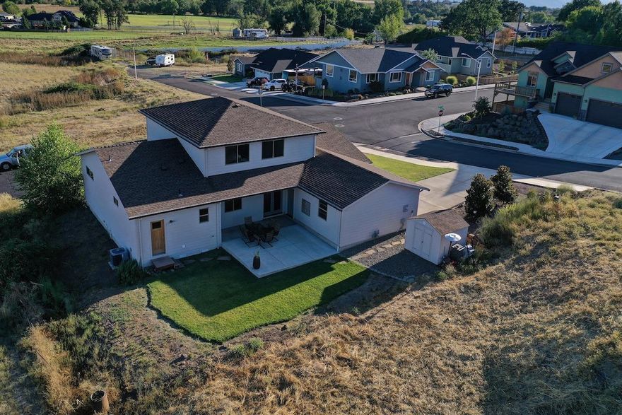 Stunning, Like-New 2014 Completely Custom-Built Contemporary Home w/Main Floor Master Suite in Amazing Location w/Views & Privacy! Stucco exterior. 1 of the most incredible modern-designed homes & priced to sell. Wonderful open floor plan w/all bedrooms on main floor + large bonus room over kitchen/dining perfect for 4th bedroom/office (semi-finished). Gorgeous large master suite w/walk-in shower, 2 sinks & walk-in closet. Monstrous large windows to take in views. Large gourmet-style kitchen w/high-end appliances overlooks spacious living room. So many upgrades & extras, just some: Upgraded stainless appliances, granite counters, large granite-top center island, upgraded vinyl plank flooring, custom cabinets, upgraded plumbing & light fixtures, custom-built shed for extra storage, natural gas BBQ line, tons of custom wood details + much more. Beautifully landscaped front & back yards w/timed sprinklers & finished 2-car garage. Room to left side of garage to add huge RV parking.