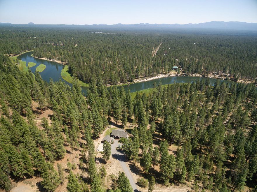 Gorgeous cottage that lives large on 2.52 acres. Vaulted ceilings and large windows show off the the National Forest and BLM. The Deschutes River is less than 200 feet from the property line, and Fall River a short hike. Fly-fishing galore. Extensive bike trails. The Master has an ensuite bathroom as well as sliding doors onto deck.  A bonus alcove with a bunkbed creates room for extra guests or can be changed to a private office. Deer and elk are visible daily from all windows.   Extensive kitchen countertops of  porcelain and a Corian top island make this a fun kitchen for cooking and entertaining. Open kitchen to dining and living area. Trex deck on the river side of the home. Pump house has a 30 amp RV hook up for you or guests. The garage is organized for one car, hanging water toys, and an area for tools.  The mature gardens are set with automated sprinklers. This property must be seen to truly understand its quiet, elegant comfort.