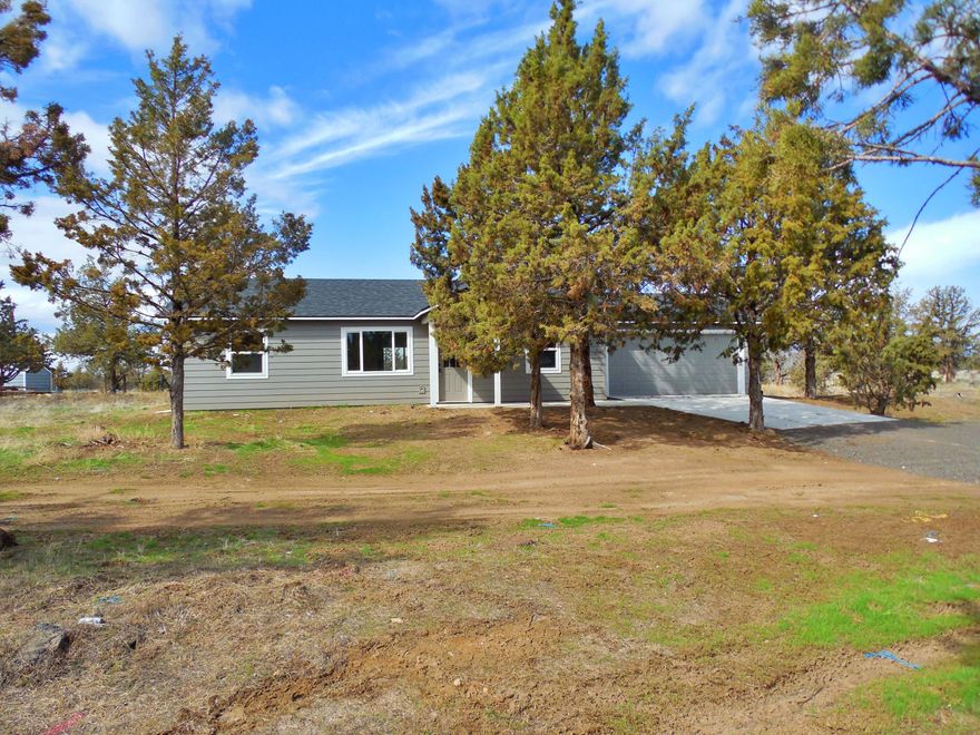 Newly remodeled Single level home on a 1.80 acre lot in Prineville Lake Acres. The Property backs to BLM and has has paved rd access. Recent updates include, Roof, Siding, Vinyl double pane windows, new Doors, Hickory Cabinets, Appliances, wood stove, fixtures, paint, carpet and waterproof plank flooring. One year home warranty provided by the seller.