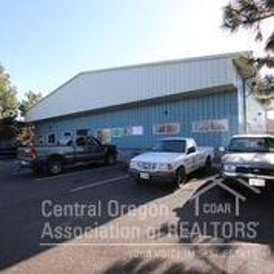 Four bay industrial building with additional 1,600 sf living quarters or office space not included in square footage. ME zone permits many different uses. Offered with an additional vacant lot of .37 acres for a total acreage of .81 acres. Vacant lot is currently used for vehicle storage.