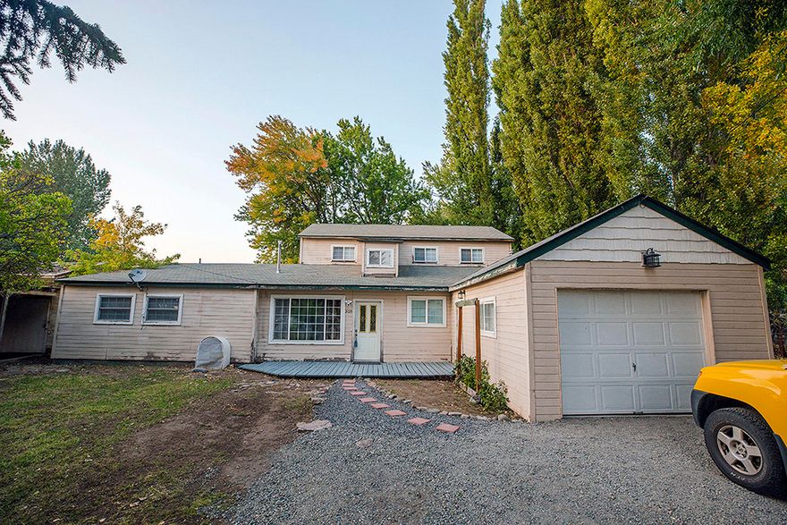 Don't miss touring this home.  Seller in progress of completing repairs.  Currently, new gas,  electric meters, new 200 amp service, downstairs bath areas upgraded.  Some doors are being repaired.  Exterior landscaping has been cleaned up and new gravel spread.
This home is located in a suburban area offering easy access to shopping, schools.
This home sits on a half acre and offers 2,628 square feet. New photos coming