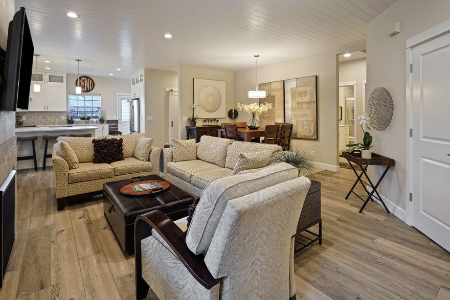 Set amongst the aspens in desirable Oakview, this completely remodeled 3 bedroom, 2 bath single level home is a delight. Everything has been redone and features include new flooring, ship lap ceiling, new paint and texture throughout, custom built-ins in the family room and primary bedroom, new kitchen cabinets, counters, appliances, fixtures, tile showers, epoxy garage flooring, closet packages, and more. Amenities include, gas fireplace in the great room, natural gas forced air heat, and A/C. Outside enjoy the low maintenance back yard and extra parking. Close to shopping, schools, medical and parks. Great NE Bend location! This home is move in ready, so bring your belongings and start enjoying all that Bend has to offer.