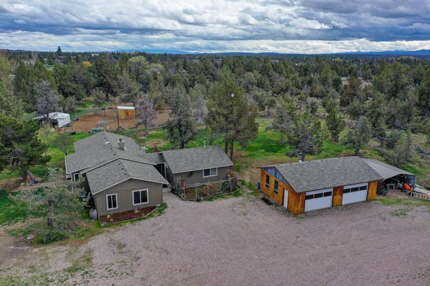 Custom Home on 5.3 Acres + Shop + Apartment! 4Bd/3Ba, 2359sf w/Master & Jr. Suites + 1Bd/1Ba att apartment w/kitchenette & hickory cabs! Extensive Bamboo flooring, main kitchen w/newer SS appl & Hickory cabs, vaulted great room w/stone FP & certified wd-stv insert, big/vaulted Master Suite w/walk-in, wood stove & pvt bath w/big jetted tub & tiled shower, upgraded vinyl thermal windows, New roof in 2013 & septic in 2018! 24x36 3+ Oil Heated Garage/Shop + Barn w/paddocks & 1 acre Irrigation too!