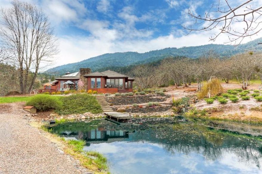 Gorgeous, single level home in the most amazing setting. There are two ponds, amazing gardens with numerous raised beds, and incredible views. The vaulted great room boasts skylights, hardwood floors and an impressive fireplace with stone surround. Gourmet kitchen with Cherry cabinets, slab granite countertops, full extension cabinets and soft closing drawers. Impressive pantry and adjacent laundry room with built-in desk. Three car attached garage and small detached shop. Geothermal heat, strong well. Priced to sell immediately.