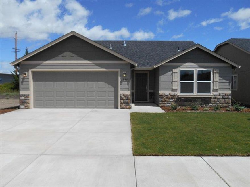 The Edgewood is a mid size home catering to those who value both comfort and efficiently. An award winning designed kitchen, featuring a breakfast bar and ample counter space, overlooks both the spacious living and dinning rooms. The separate master suite affords you privacy with a large dual vanity bathroom. Two sizeable bedrooms that share a full bathroom. This home also has a gas fireplace, ceiling fan in the great room, 4 craftsman trim, utility room wall cabinets, Stand up shower with glass enclosure in the master bath. Corner Lot. Home to be completed Late January. Pictures are similar.