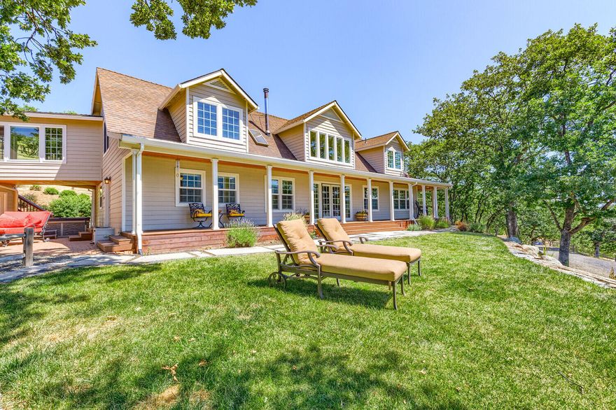 Discover multi generational luxury living at 6015 Dark Hollow in Medford OR. This home offers 5 acres, amazing views, wrap around covered decks, over 4,200 sqft. w/2 primary en suites (1 upstairs and 1 downstairs) 2 other bedrooms, 4.5 baths & 3 fireplaces (2 propane, 1 wood stove).  Step inside & be greeted by a grand foyer with floor-to-ceiling windows that allow the sunshine to bathe the Livingroom.  The beautiful gourmet kitchen has abundant counter space & huge breakfast bar island. The main level & backyard w/expansive decks,
outdoor kitchen, patio are wonderful for entertaining!  The Hot Tub is great for you to unwind and savor the beauty of nature.  Wonderful location near Historic Jacksonville, Ashland, and esteemed medical facilities like Asante & Providence Hospitals are appx 20 min. away.  So with its impressive views, and unbeatable location, this residence offers luxury, tranquility, and convenience. Schedule showing today